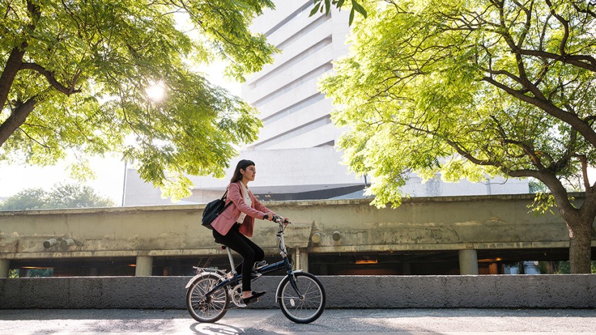 Avery Green Month 2021_Girl on bike green trees