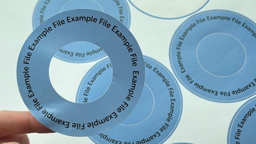 Round label with an inner cutout on a sheet