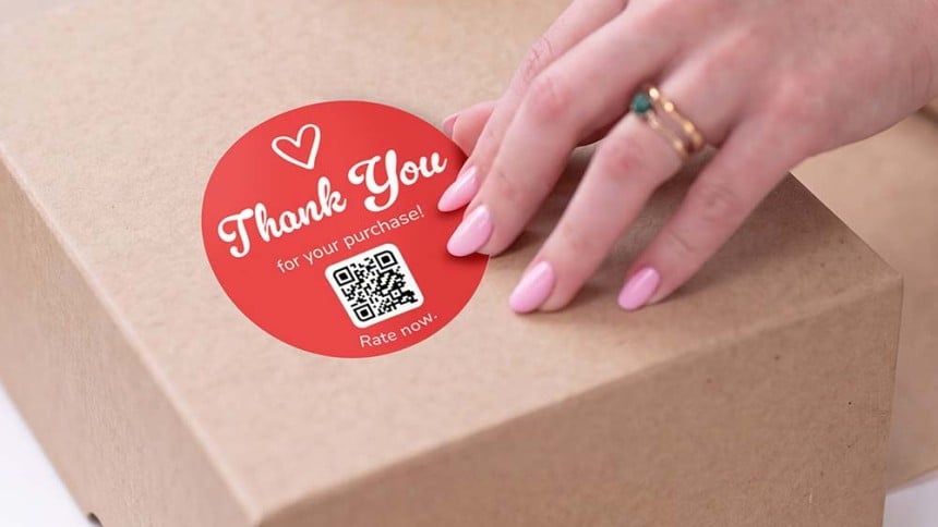 hand applying rate review qr sticker