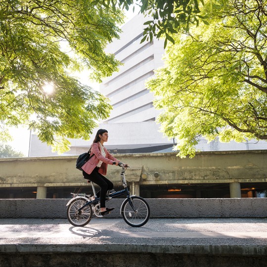 Avery Green Month 2021_Girl on bike green trees