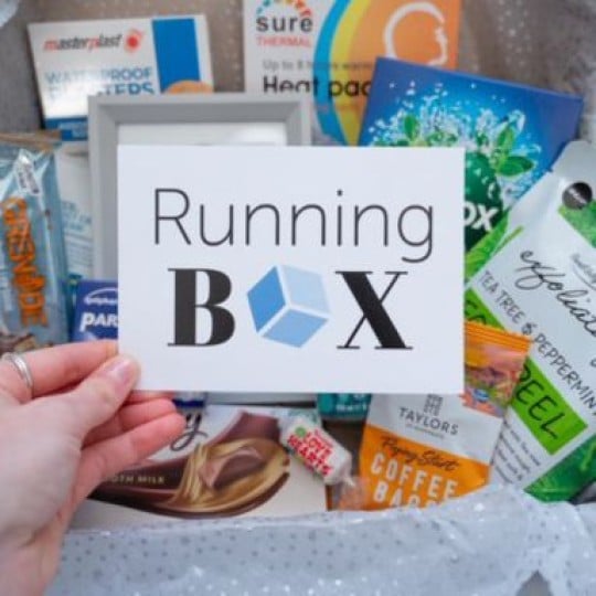Running Box Gifts holding business card