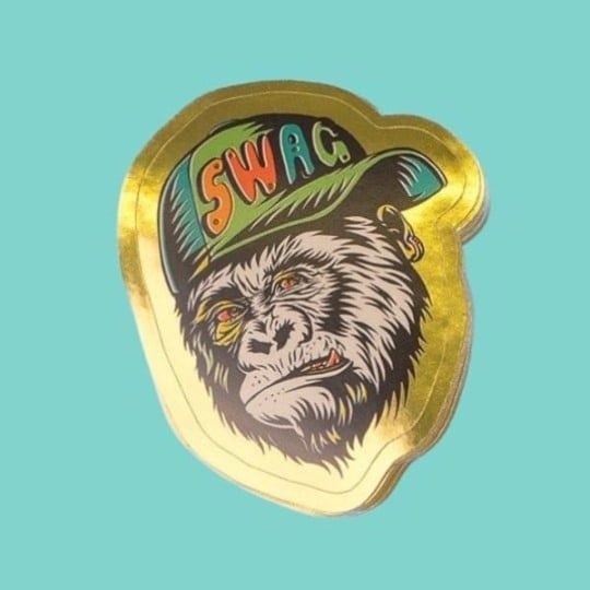 Gold paper sticker gorilla wearing a hat