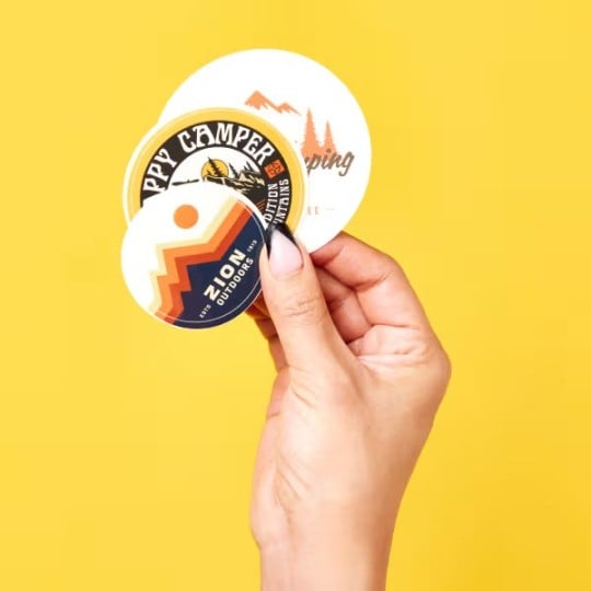round stickers in hand