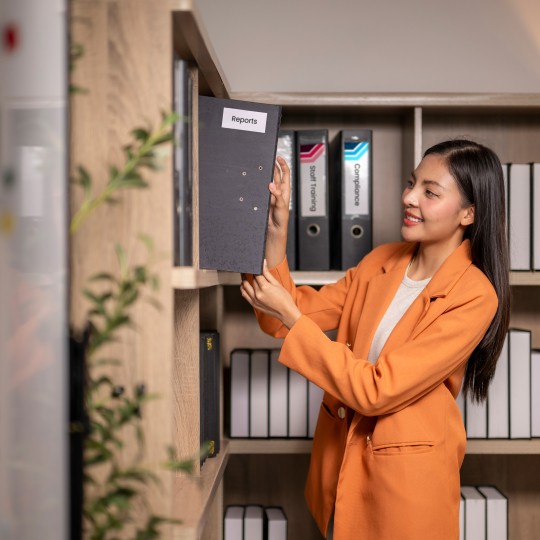 Woman reviewing files
