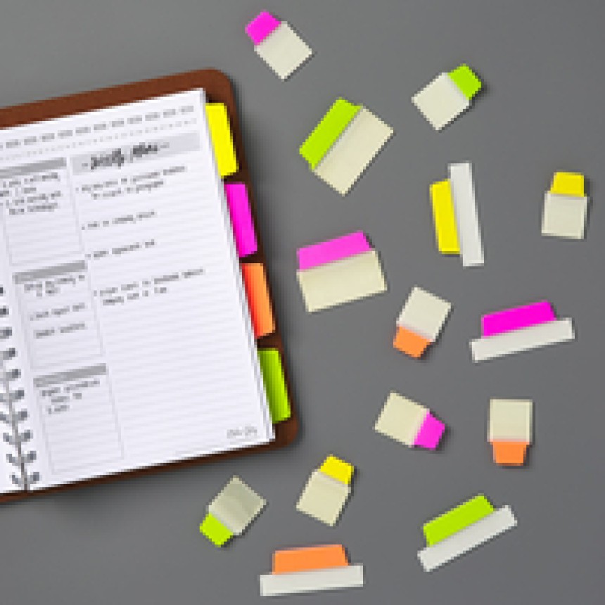 Planner with Ultra Tabs in bright colours on the planner and a selection next to.