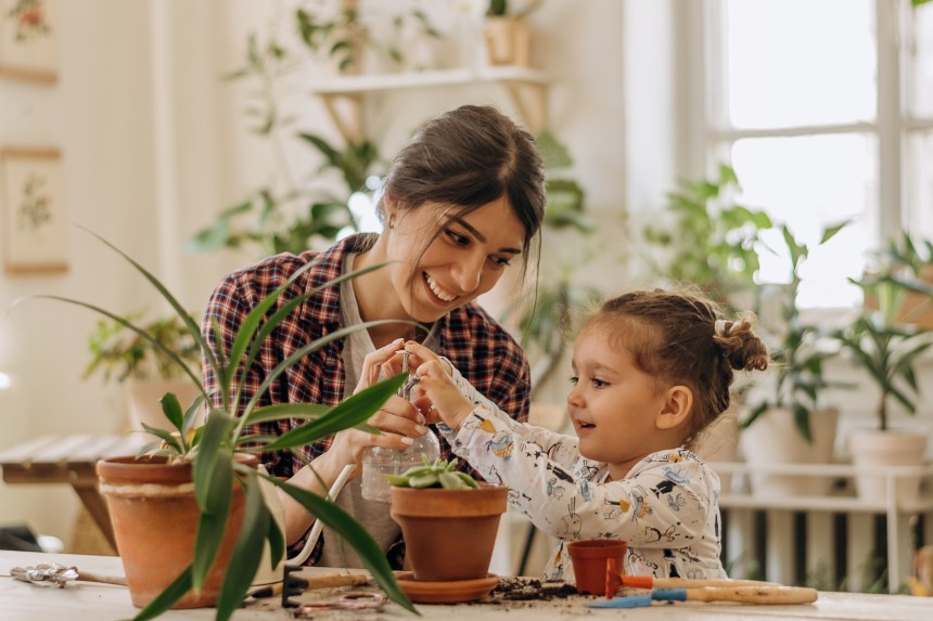 Mother and girl plants green month