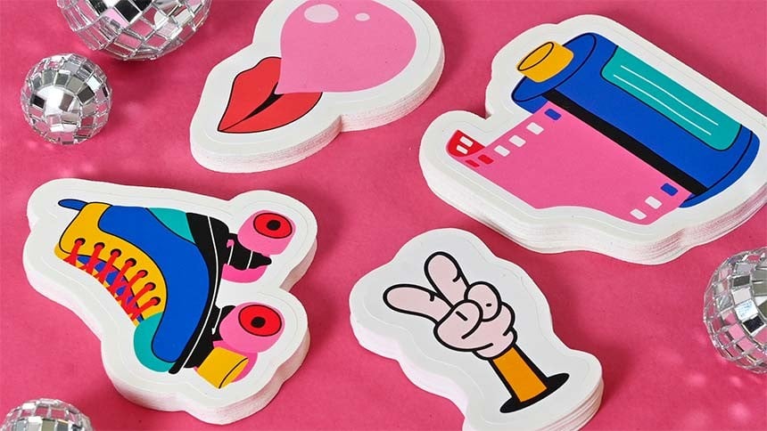 Die cut stickers with glitter ball on pink background