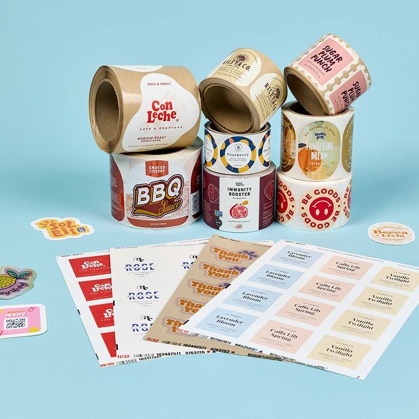 Roll, sheet and single cut printed labels on blue background