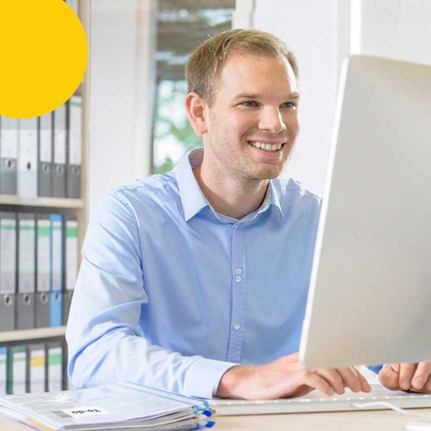 Man Typing At Computer