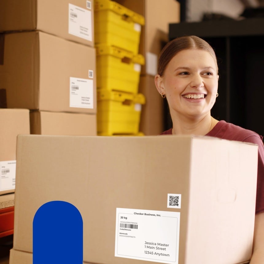 lady holding box with label in warehouse