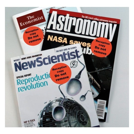 The image contains three magazines: The Economist, Astronomy, and New Scientist, each labeled 'Reception copy Do not remove'. The New Scientist cover discusses 'Reproductive revolution'.