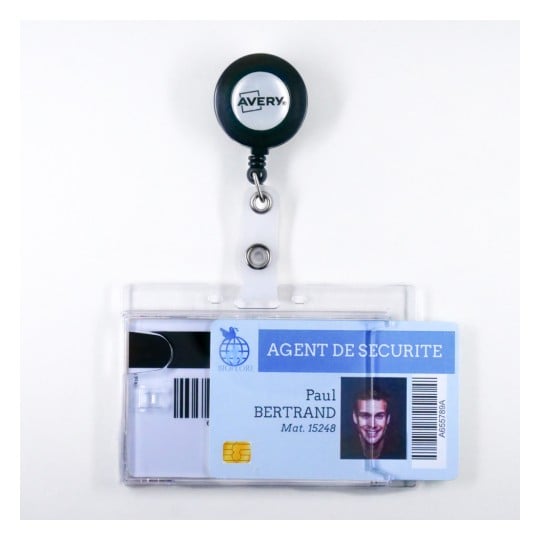 The image displays an identification badge for a security agent labeled 'AGENT DE SECURITE.' It includes the name 'Paul Bertrand,' with a photo, badge number, and a magnetic strip. The badge is attached to a retractable reel labeled 'Avery.'
