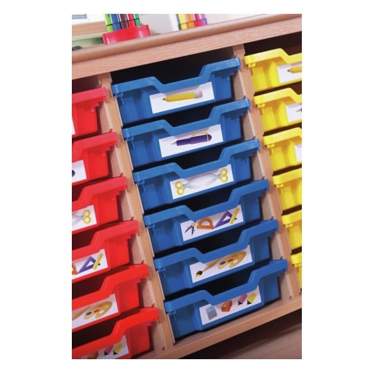 The image shows a wooden storage unit with colored bins, specifically red, blue, and yellow, containing labeled supplies such as pencils, pens, and art tools.