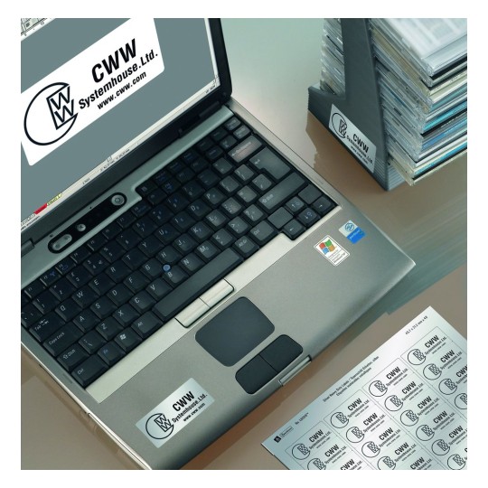 An image showing a laptop with a CWW Systemhouse Ltd. logo on it. There is also a stack of CDs and a sheet of labels in the foreground, indicating branding materials.
