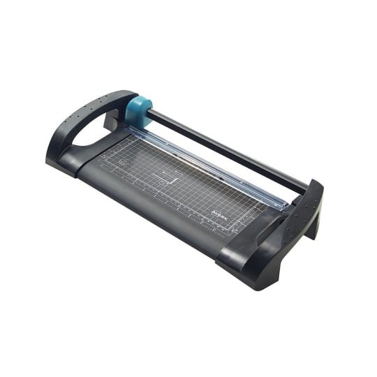 The image shows a paper trimmer, a tool used for cutting paper in straight lines. It has a blade and a marked cutting base with measurement grids.
