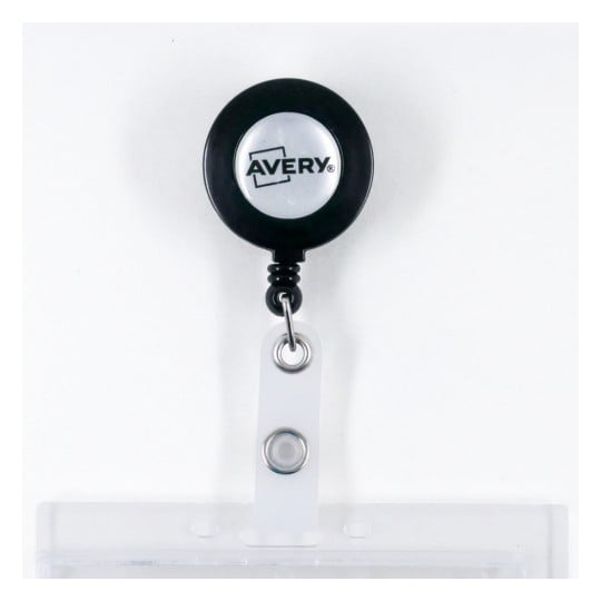 The image shows a black retractable badge holder with the brand name 'Avery' visible on it. The holder has a clear plastic card slot attached.