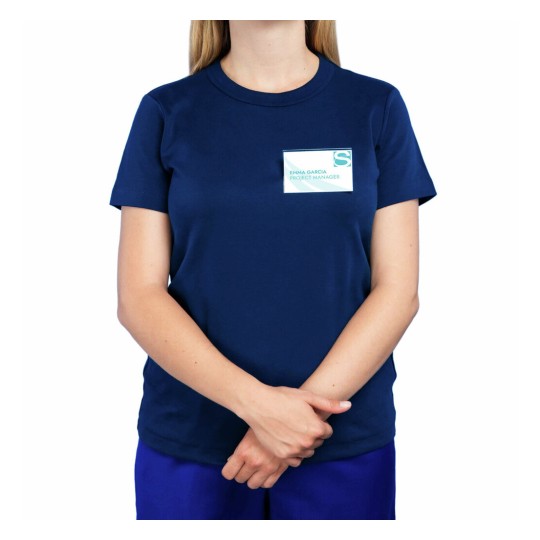 The image shows a person wearing a navy blue t-shirt with a name badge that reads 'Emma Garcia, Project Manager'. The individual has their arms crossed in front of them. The background is plain white.
