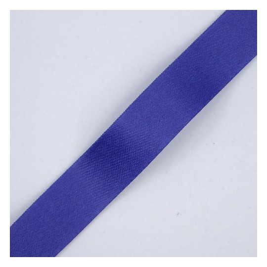The image shows a flat piece of purple ribbon on a light gray background. The ribbon has a smooth texture and appears to be a fabric material, commonly used for decoration or crafting purposes.