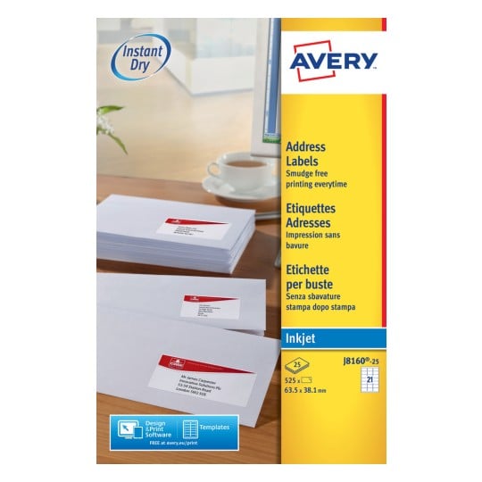 The image shows a package of Avery address labels, with product information such as 'Instant Dry' and 'Smudge free printing every time'. There are also some sealed envelopes visible on a desk with a cup of coffee.