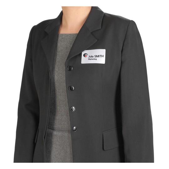 The image shows a person wearing a black blazer with a gray undershirt, with a name tag that indicates the name 'Julia SMITH' and 'Marketing'.