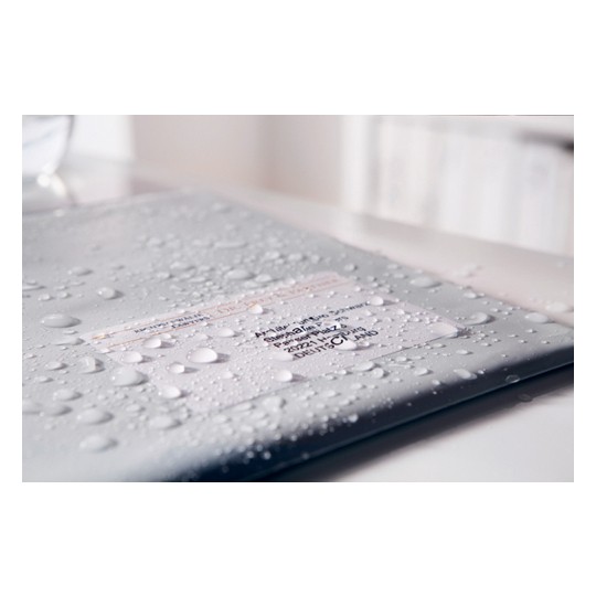 The image shows a wet folder or document with droplets of water on it. The label on the folder appears to contain personal information but is partially obscured by moisture. It suggests the item was exposed to water.
