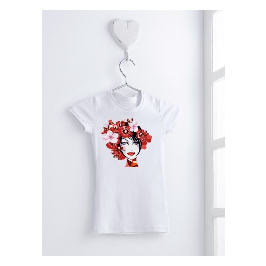 A white T-shirt hanging on a hanger, displaying an artistic design of a female face surrounded by flowers.