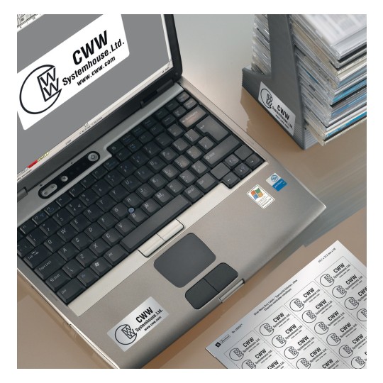 An image showing a laptop with a CWW Systemhouse Ltd. logo on it. There is also a stack of CDs and a sheet of labels in the foreground, indicating branding materials.
