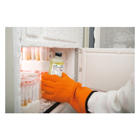 A hand wearing an orange glove is retrieving a bottle from a frozen freezer compartment filled with containers. The interior is frosted, and the contents appear to be cold.