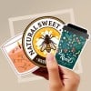 Custom stickers held in a hand