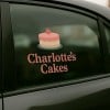 Car window sticker advertising a cake business