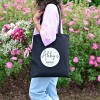 Fabric transfer paper ironed onto a tot bag girl walking