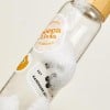 Waterproof plastic sticker on drinks bottle with bubbles