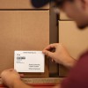 Shipping Man Applying Label