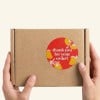 Branded sticker on cardboard packaging box