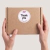 White Thank you sticker on box