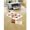 The image shows a printer with reservation cards printed for a restaurant called 'Skyline.' The cards display details like the name M. Lindermann and the reservation for 8 persons starting at 18:00.