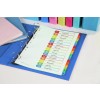 The image shows a close-up of an organized binder with dividers labeled by topics such as 'Monthly Schedule,' 'Business Summary,' and 'Market Trends.' There are also colorful folders and a pink notebook in the background.