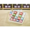 The image features a neatly arranged box containing colorful candles of various shapes and sizes. Each candle has a label with the brand name 'Floral Nature.' The background showcases additional candles and decorative boxes.