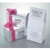 The image displays two silver gift boxes of luxury handmade truffles with pink ribbons. In addition, there is a packaging for organic loose-leaf tea labeled 'Simply Tea' and 'Original Blend'.