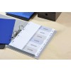 An organized binder with tabs labeled for agenda, budget, details, clients, services, and actions. The binder is on a wooden surface alongside blue and black folders.
