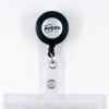 The image shows a black retractable badge holder with the brand name 'Avery' visible on it. The holder has a clear plastic card slot attached.