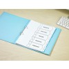 The image shows a binder with labeled tabs for budgets, analysis, pricing, markets, and forecast, placed on a wooden desk next to a keyboard.