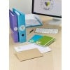 The image features an organized workspace with colorful binders, notebooks, and envelopes on a wooden desk. A computer monitor displays a logo design for a company. Items include blue, green, and purple binders, several envelopes, and a keyboard.