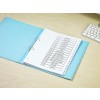 The image features a binder with various labeled sections such as budgets, analysis, pricing, and marketing. The binder is on a light wooden surface near a keyboard.