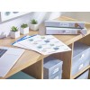 The image shows a stylish workspace with a wooden desk featuring a laptop, printed documents, and colorful binders labeled 'Utility' and 'Our Insurance.' There are also small potted plants and storage boxes organized neatly.