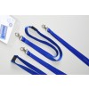The image features multiple blue lanyards with clasps, one attached to a clear ID card holder that displays text in French, indicating a group meeting.