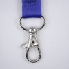 The image shows a metallic swivel clip attached to a blue strap. The clip is designed for securing items and features a spring-loaded latch for easy attachment and detachment.