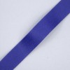 The image shows a flat piece of purple ribbon on a light gray background. The ribbon has a smooth texture and appears to be a fabric material, commonly used for decoration or crafting purposes.