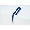 The image shows a blue lanyard with a clasp resting on a white surface. The lanyard has a smooth texture and a buckle feature.