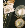 The image shows a glass bottle with a cork, marked with 'Homemade Brew' and a candle in a glass holder with white stones. The candle has a label with 'Vanilla Candle'.